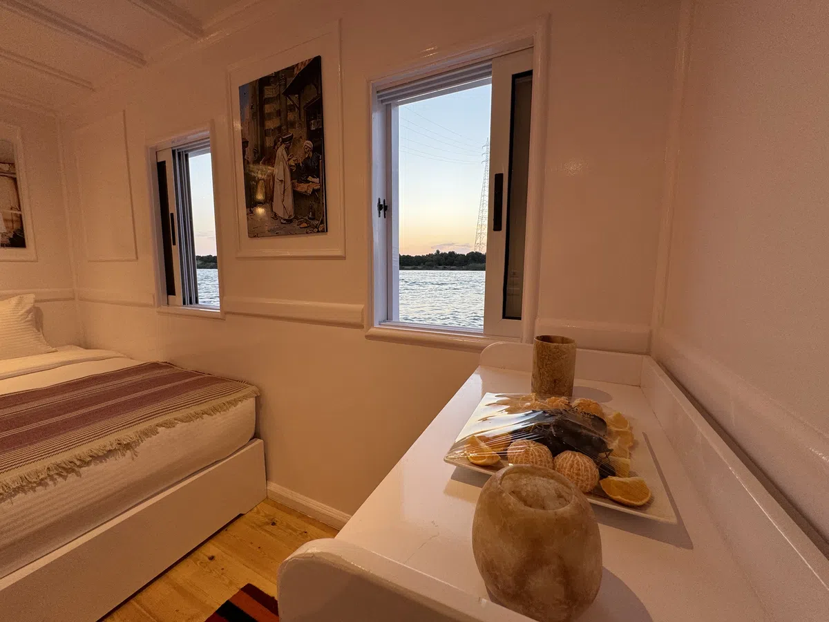 Dahabiya cabin interior aboard Soul of the Nile luxury Nile cruise — 2027 Solar Eclipse trip