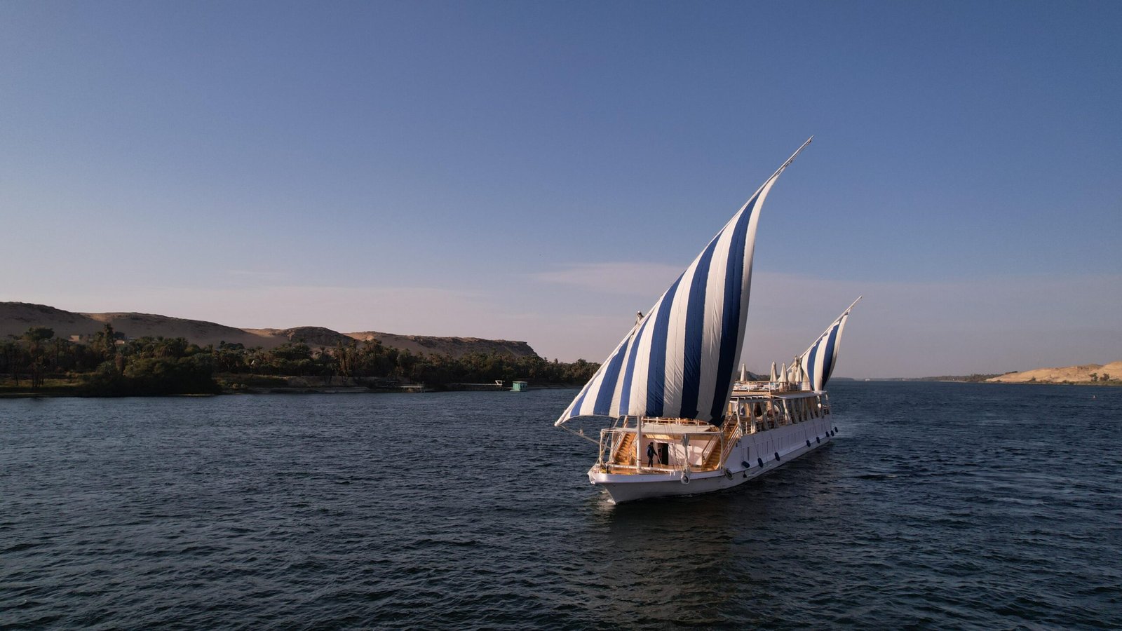 Luxury Dahabiya Soul of the Nile sailing peacefully on the River Nile at sunset
